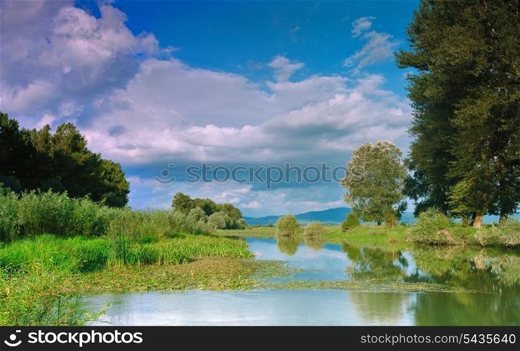 River landscape with sunset and reflection