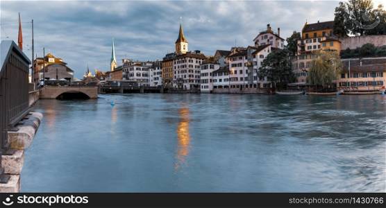 River Limmat with Fraumunster and Church of St Peter in the morning in Old Town of Zurich, the largest city in Switzerland. Zurich, the largest city in Switzerland