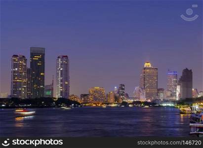 river Mae Nam Chao Phraya in Bangkok with panorama and skyscraper twilight