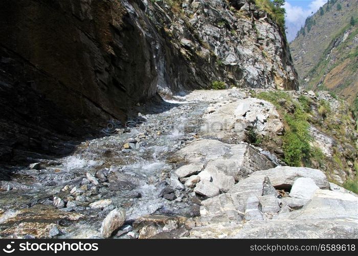 River on the dirt road on the Annapurna trail in Nepal