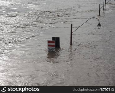 River Po flood in Turin. Street Lamp on Murazzi bank of River Po submerged in water due to flood in city centre in Turin, Italy