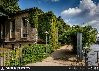 River Spree Embankment and House with Grape Vines, Berlin, Germany