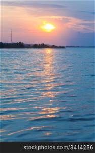River sunset view with sunlight path on water surface(Dnieper, Ukraine).