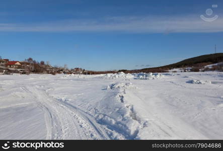 River under the snow and ice. Russia. Kandalaksha Bay of the White Sea.
