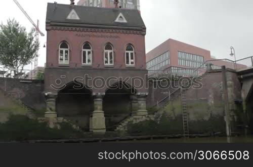 River view. House on the river. Shot from a boat. Hamburg, Germany.