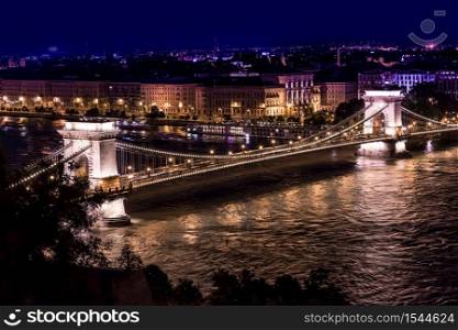 River view of Budapest at evening, illuminated Chain Bridge