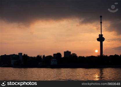 River view of the Rotterdam skyline at sunset, on the right Euromast Tower, Netherlands, South Holland province.