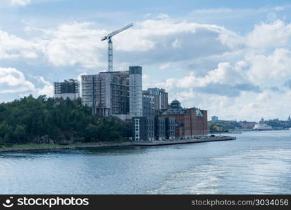 Riverfront development of Kvarnholmen Stockholm. Development of modern apartments and community at Kvarnholmen in Stockholm, Sweden. Riverfront development of Kvarnholmen Stockholm