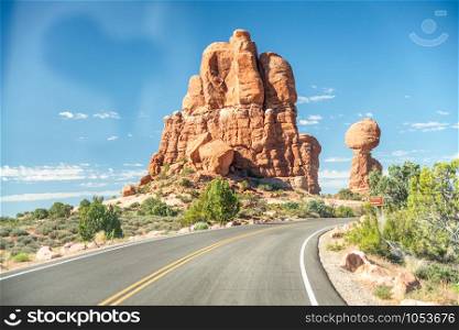 Road across the nature on a beautiful summer day, Arches National Park, Utah.