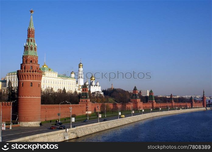 Road and red walls of Kremlin in Moscow