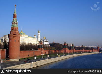 Road and red walls of Kremlin in Moscow