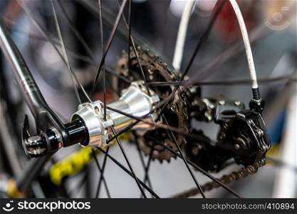 Road bicycle rear wheel hub with multi speed cassette and chain with spokes and rim