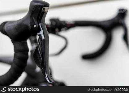 Road bike black shifterd located on bar integrated wirh brakes