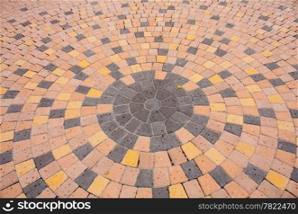road corridor. Arranged patterns of stone ground into a colorful circle.