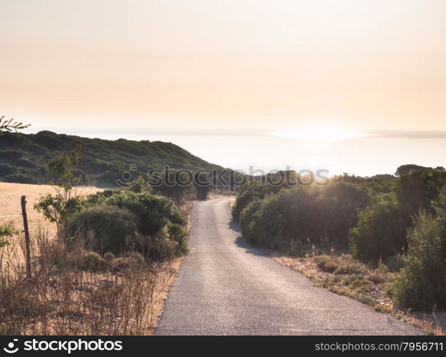 road country sunset. Road to the sea meet the sunset in sardinia country