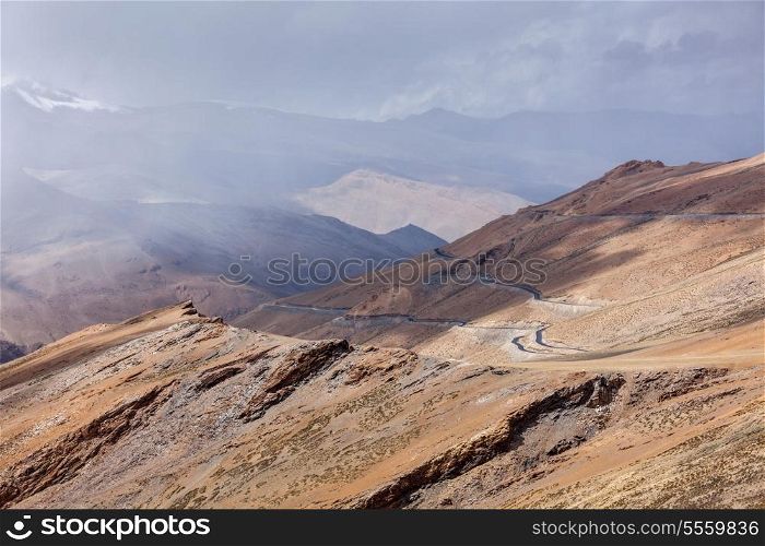 Road in Himalayas in clouds near Tanglang la Pass - Himalayan mountain pass on the Leh-Manali highway. Ladakh, India