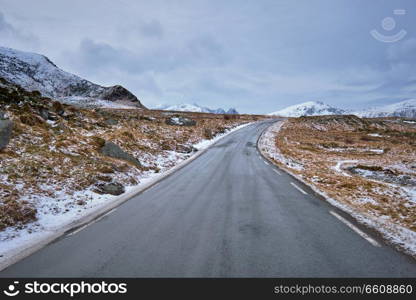 Road in Norwegian fjord. Lofoten islands, Norway. Road in Norway in winter