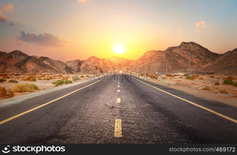 Road in the desert of Egypt at sunset