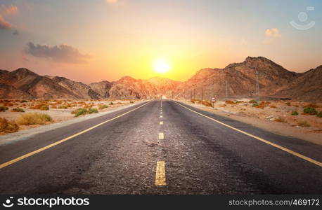 Road in the desert of Egypt at sunset