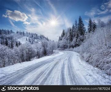 Road in the mountains covered with snow. Winter landscape. The concept of freedom and movement.. Road in the mountains covered with snow