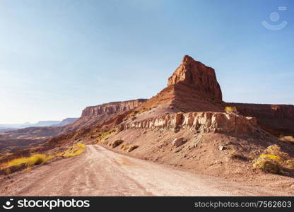 Road in the prairie country. Deserted natural travel background.