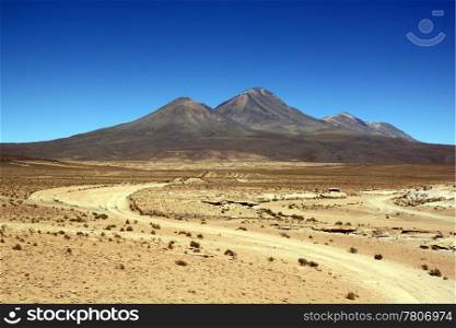 Road in the sand desert and mountain near Uyuni in Bolivia