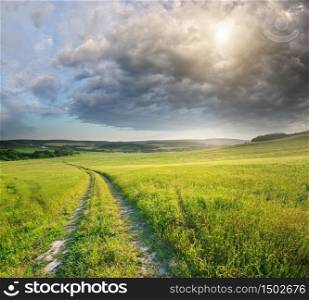 Road lane and heavy rainy clouds. Nature design.