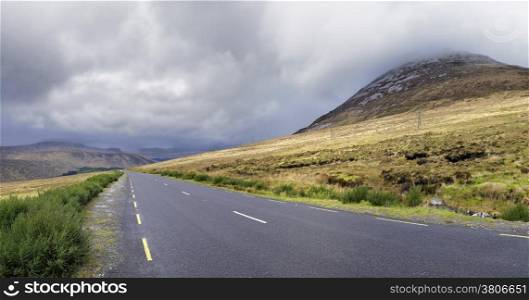 Road near the Errigal mountain in county Donegal Ireland on a cloudy day