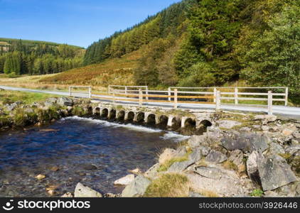 Road of the Abergwesyn Pass crossing over the River Afon Irfon. Powys, Wales, United Kingdom, Europe.