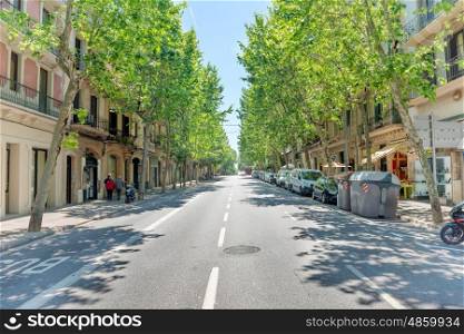 Road on the city street. Cityscape with urban traffic in Barcelona, Spain