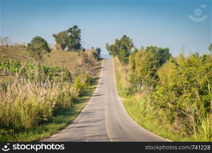 Road on the hill with blue sky landscape