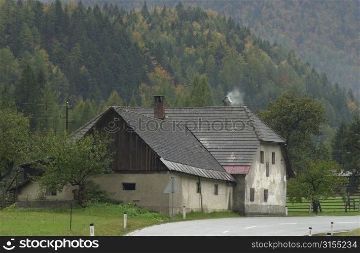 Road passing by a country home in Slovenia