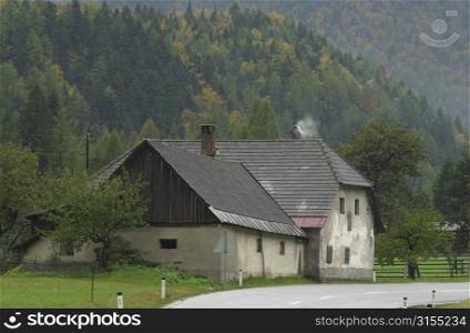 Road passing by a country home in Slovenia