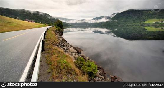 Road passing through mountains, Granvinsvatnet, Granvin, Hordaland County, Norway