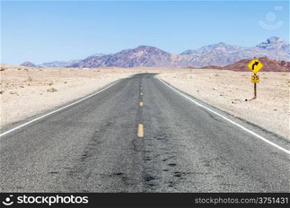 Road prospective in the middle of Death Valley desert, USA
