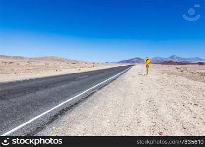 Road prospective in the middle of Death Valley desert, USA