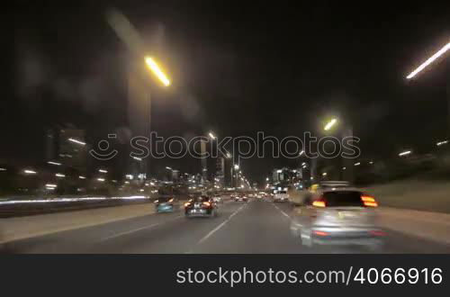 Road rage camera car driving from the West with the awesome skyline of Chicago. Gorgeous, high-energy roads time lapse between the skyscrapers. Good cityscape for a modern video background. Great for any driving, corporate, city or urban ideas in the United States of America.