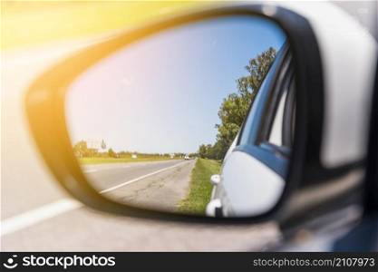 road reflected side mirror