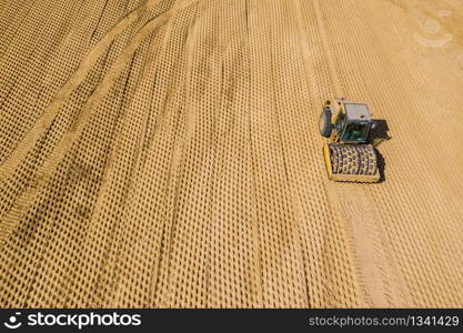 Road rollers working on the construction site aerial view