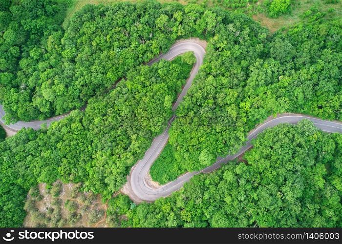 Road serpentine in mountain. Aerial nature scene.