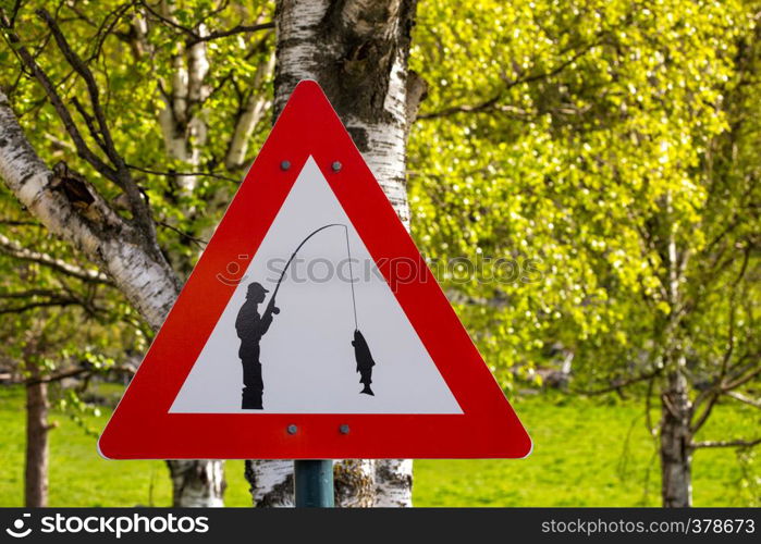 road sign - carefully fisherman catches a fish, norway