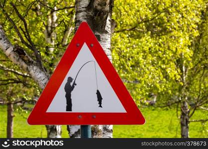 road sign - carefully fisherman catches a fish, norway