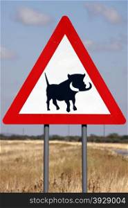 Road sign in Namibia warning of Warthogs