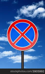 road sign no parking against blue sky and clouds