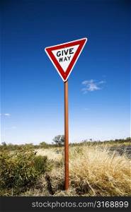 Road sign reading Give Way in rural Australia.