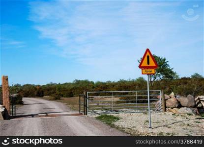 Road sign with warning for rails on the road. From the swedish island oland.