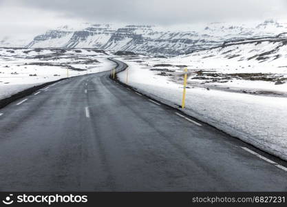 Road streching out Iceland Winter landscape snow mountain