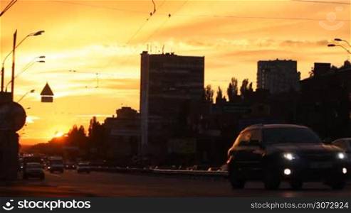 road traffic in the city at sunset