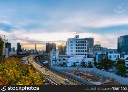 road traffic transportation and city in bangkok at twilight sunray and tree pot