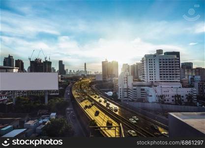 road traffic transportation and city in bangkok at twilight sunray and white big billboard